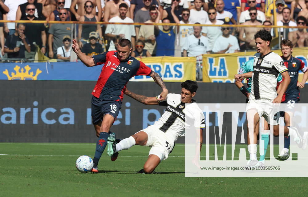 Genoas Milutin Osmajic fights for the ball with Parmas Mariano Troilo during the Serie A soccer match between Parma and Genoa at the Ennio Tardini Stadium in Parma, north west Italy - September 20, 2026. - Soccer