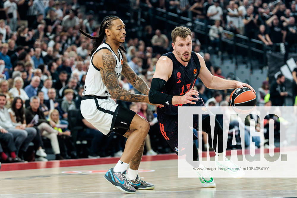 Andreas Andi Obst (FC Bayern Muenchen, 13) controls the ball against Kyle Allman (Partizan Mozzart Bet Belgrade, 0) during the Turkish Airlines EuroLeague match between FC Bayern Muenchen vs. Partizan Mozzart Bet Belgrade at SAP Garden on round 3 of Turkish Airlines EuroLeague on October 02, 2026 in Munich, Germany. Bavaria Germany