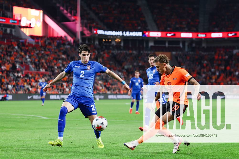 EINDHOVEN - (lr) Kosta Nedeljković of Serbia, Noa Lang of the Netherlands during the UEFA Nations League match between the Netherlands and Serbia at the Philips Stadium on 4 October 2026 in Eindhoven, the Netherlands. SONNY LENSEN ANP ANPxSportx IVx 571517493 originalFilename: 571517493