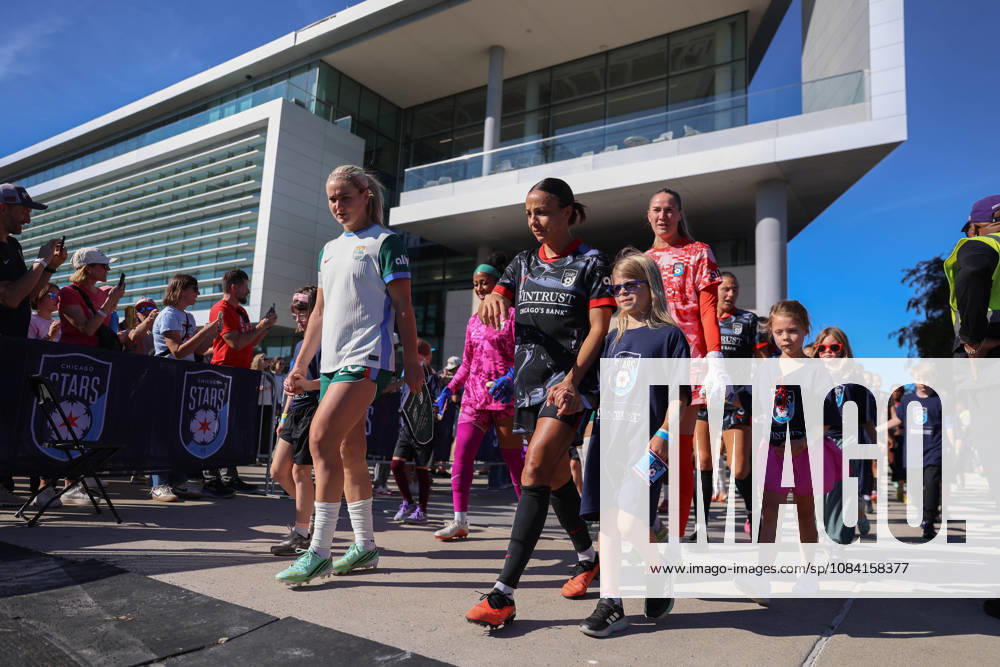 Lindsey Heaps (10 Denver Summit FC) and Mallory Swanson (9 Chicago Stars FC) walk onto the pitch before the game between the Chicago Stars FC and Denver Summit FC at Northwestern Medicine Field at Martin Stadium on Sunday, October 4 in Evanston, USA