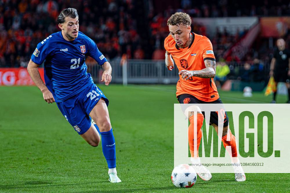 EINDHOVEN - Noa Lang of the Netherlands battles for possession with Lazar Vujadin Samardzic of Serbia during the UEFA Nations League match between the Netherlands and Serbia at the Philips Stadium on 04 October 2026 in Eindhoven, the Netherlands. KEVIN SENDERS ANP UEFA Nations League 2026 27 ANPxSportx xMarcelxterxBalsxIVx 571534149 originalFilename: 571534149