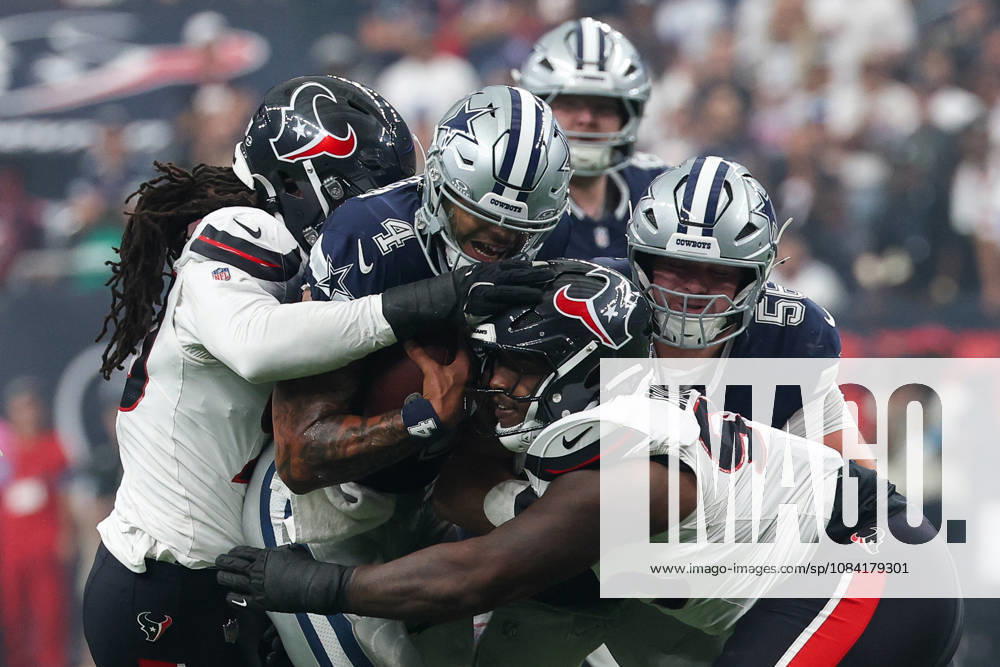 HOUSTON, TX - OCTOBER 04: Quarterback Dak Prescott 4 of the Dallas Cowboys is hit by defensive end Jadeveon Clowney 90 of the Houston Texans and defensive end Jaden Crumedy 95 of the Houston Texans during the NFL, American Football Herren, USA football game between the Houston Texans and Dallas Cowboys on October 4, 2026, at Reliant Stadium in Houston, TX. (Photo by David Buono Icon Sportswire) NFL: OCT 04 Cowboys at Texans Icon241004142