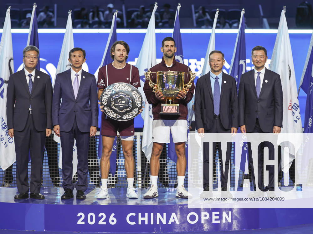 (261006) -- BEIJING, Oct. 6, 2026 -- Winner Novak Djokovic (3rd R) of Serbia and runner-up Alex de Minaur (3rd L) of Australia pose for photos during the awarding ceremony for the men s singles final at 2026 China Open tennis tournament in Beijing, China, Oct. 6, 2026. ) (SP)CHINA-BEIJING-TENNIS-CHINA OPEN-MEN S SINGLES-AWARDING CEREMONY(CN) BaixXuefei