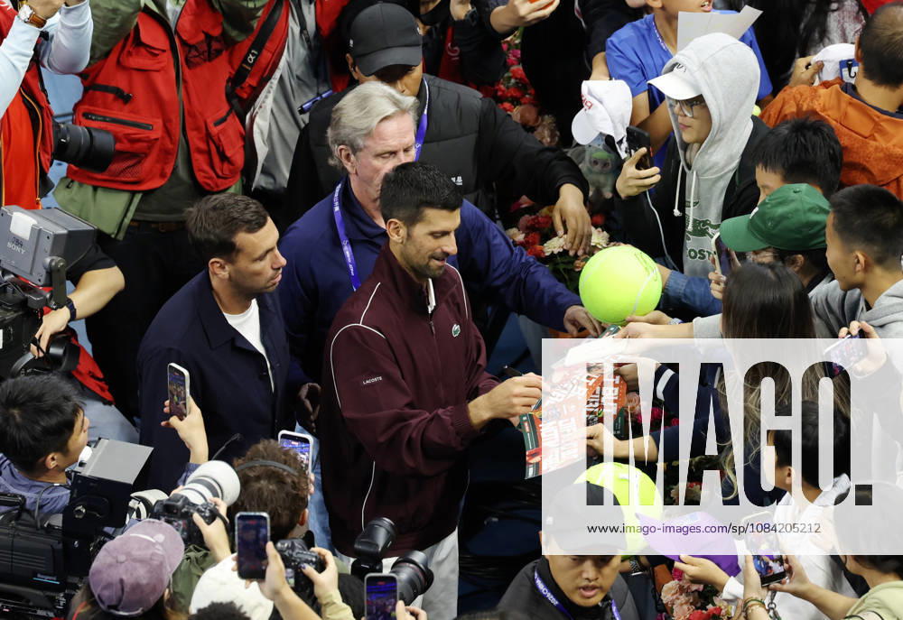 (261006) -- BEIJING, Oct. 6, 2026 -- Novak Djokovic of Serbia signs autographs for supporters after the awarding ceremony for the men s singles final at 2026 China Open tennis tournament in Beijing, China, Oct. 6, 2026. ) (SP)CHINA-BEIJING-TENNIS-CHINA OPEN-MEN S SINGLES-AWARDING CEREMONY(CN) ZhangxChenlin