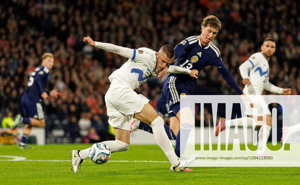 Scotland v Slovenia: David Zec of Slovenia with Jack Hendry of Scotland