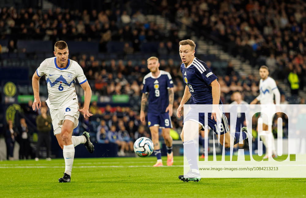 Scotland v Slovenia: Lewis Ferguson of Scotland chased by Jaka Bijol of Slovenia