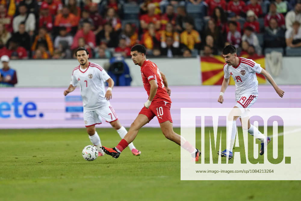 Mohamed Zeki Amdouni (10 SUI) against Eljif Elmas (7 MKD) and Ljupche Doriev (19 MKD) during the UEFA Nations League match between Switzerland and North Macedonia at thermoplan arena on October 06, 2026 in Luzern, Switzerland.