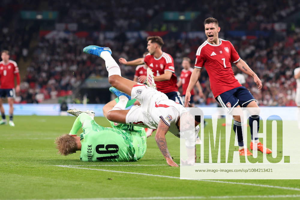 England v Czechia 06 October 2026, London - International Football - UEFA Nations League - England v Czechia - Czechia goalkeeper Lukas Hornicek punches the ball clear and sends Morgan Rogers of England flying - Photo: Charlotte Wilson Offside. London UK