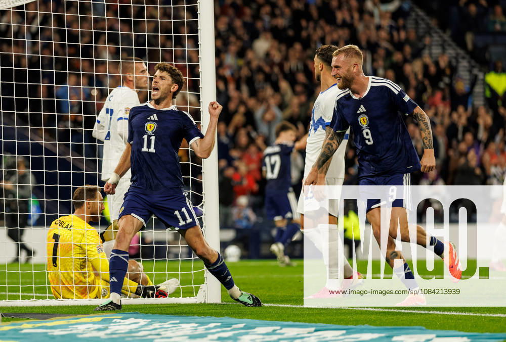 Scotland v Slovenia: Ryan Christie of Scotland scores with a backheel and celebrates