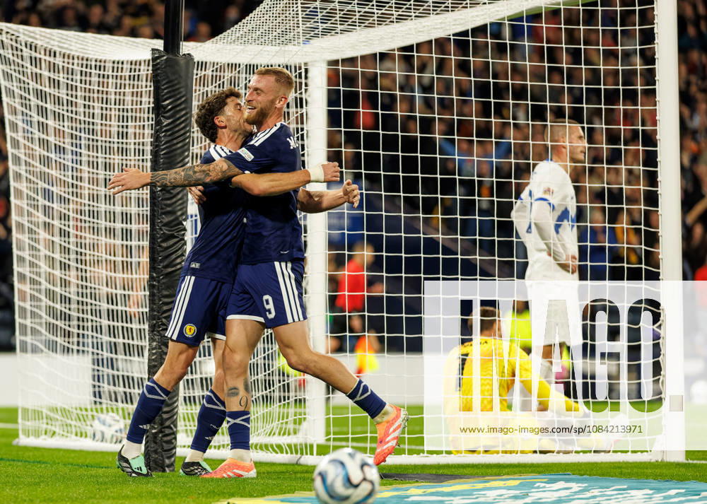 Scotland v Slovenia: Ryan Christie celeberates with Oliver McBurnie of Scotland