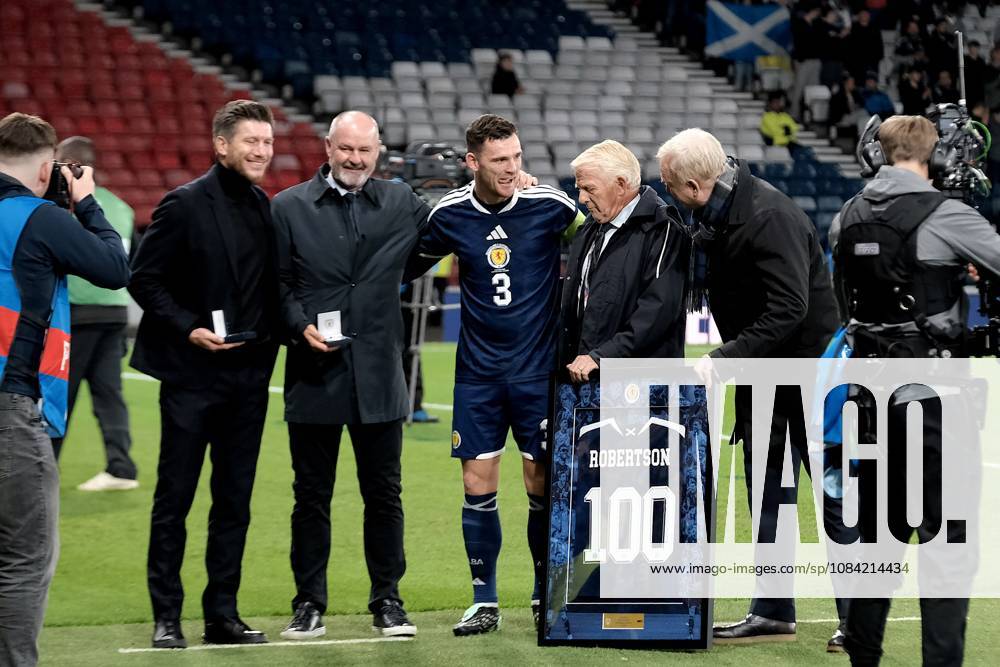 UK: Scotland v Slovenia, UEFA Nations League at Barclays Hampden, Glasgow, Scotland on 06 October 2026: Pictured: Scotland Coach Sebastien Pocognoli, Steve Clarke, Gordon Strachan and Alex McLeish present Andy Robertson (Scotland) with a jersey to commemorate his 100th cap Glasgow Barclays Hampden Scotland