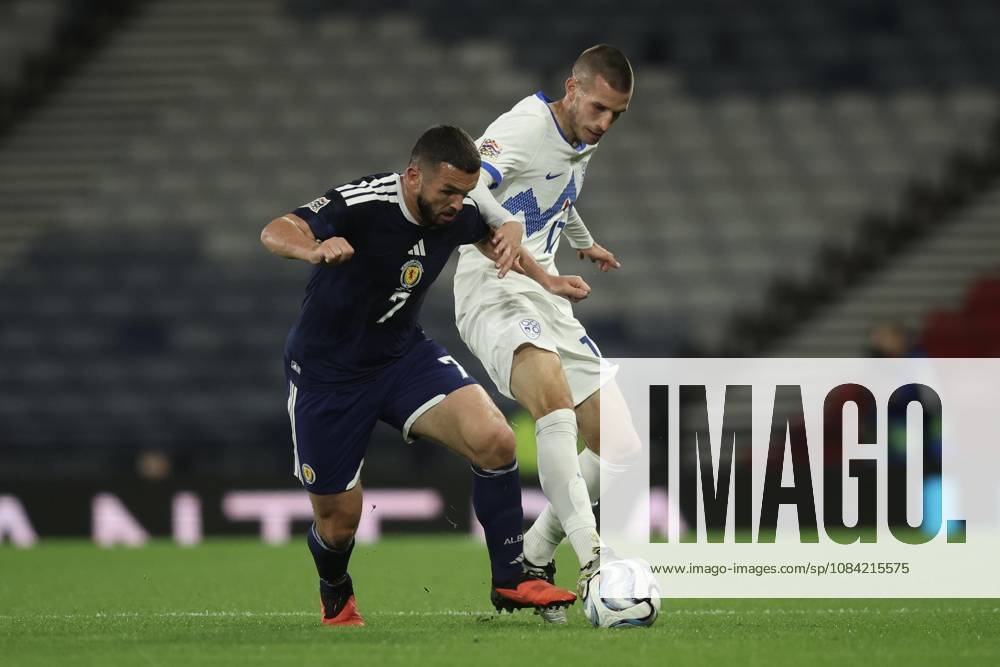 6th October 2026; Hampden Park, Glasgow, Scotland; UEFA Nations League Football, Scotland versus Slovenia; John McGinn of Scotland challenges for the ball with David Zec of Slovenia DavidxYoung