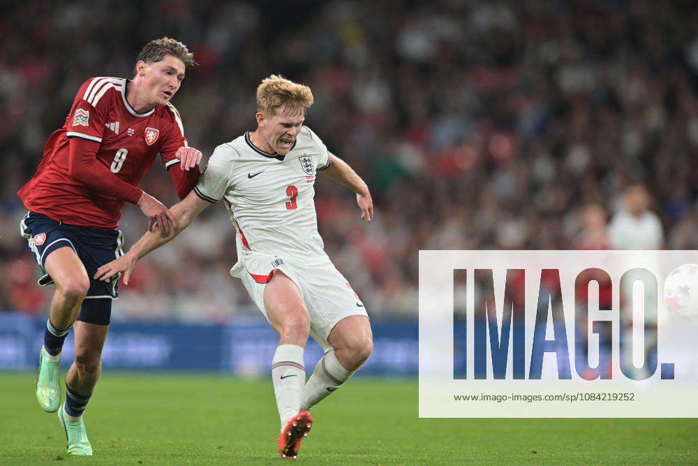 Lewis Hall of England guards the ball as Ryan Naderi of Czechia closes in during the Nations League match between England and Czechia at Wembley Stadium, London, England on 6 October 2026.