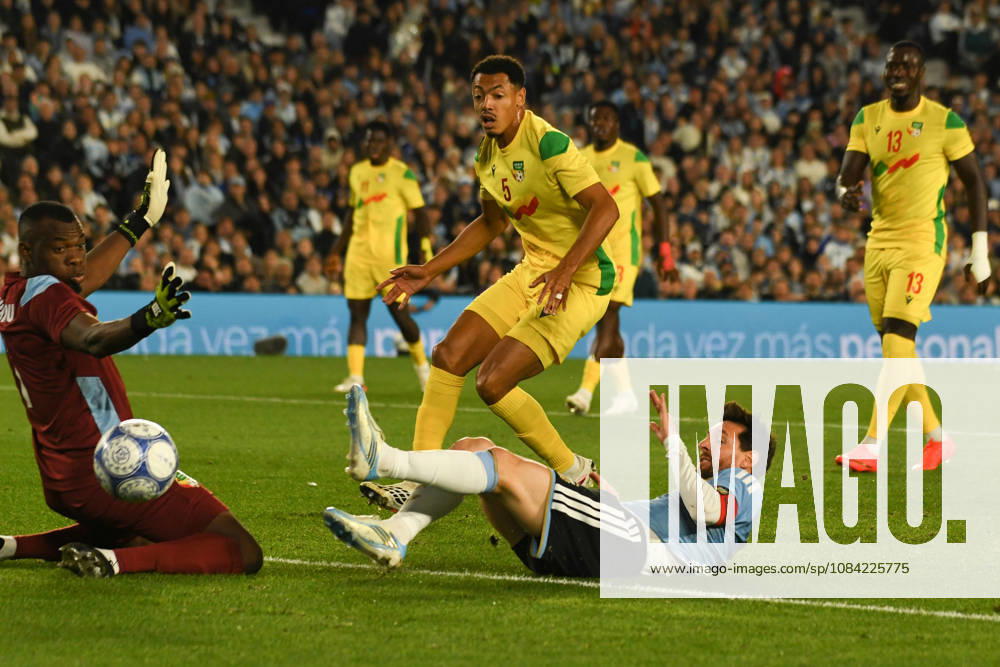 BUENOS AIRES, ARGENTINA 6 OCTOBER: Argentine player Lionel Messi comes very close to scoring a goal, but Benin goalkeeper Marcel Dandjinou makes the save, whilst midfielder Yohan Roche looks on, during a friendly match between Argentina and Benin at the Estadio Monumental Antonio V. Liberti on 6 October 2026 in Buenos Aires, Argentina.