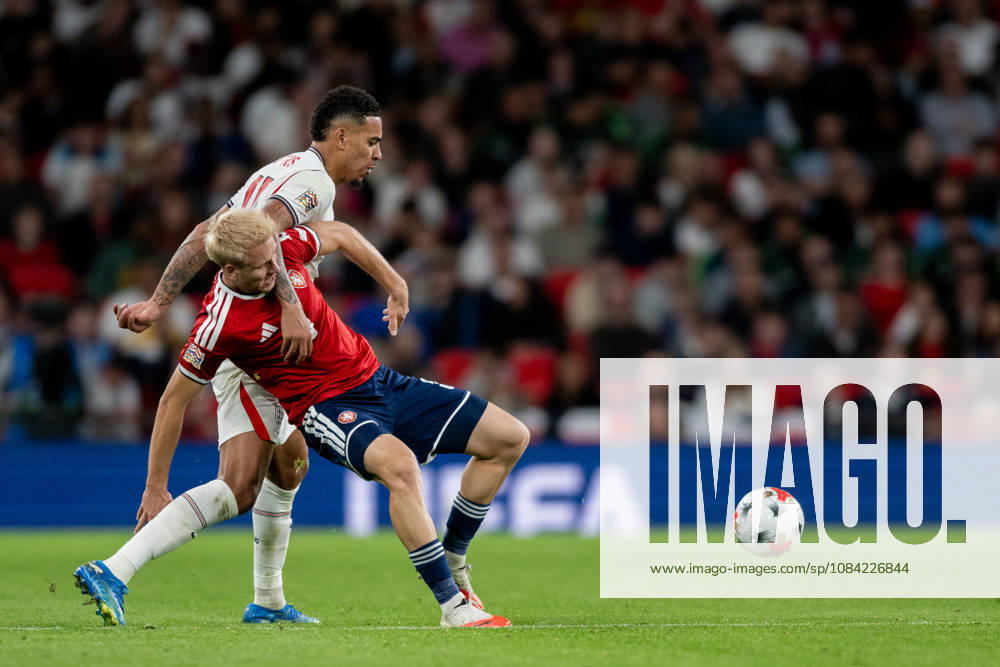 Morgan Rogers of England and Aindrej Zmrzly of Czechia challenge for the ball during the Nations League match between England and Czechia at Wembley Stadium, London, England on 6 October 2026.