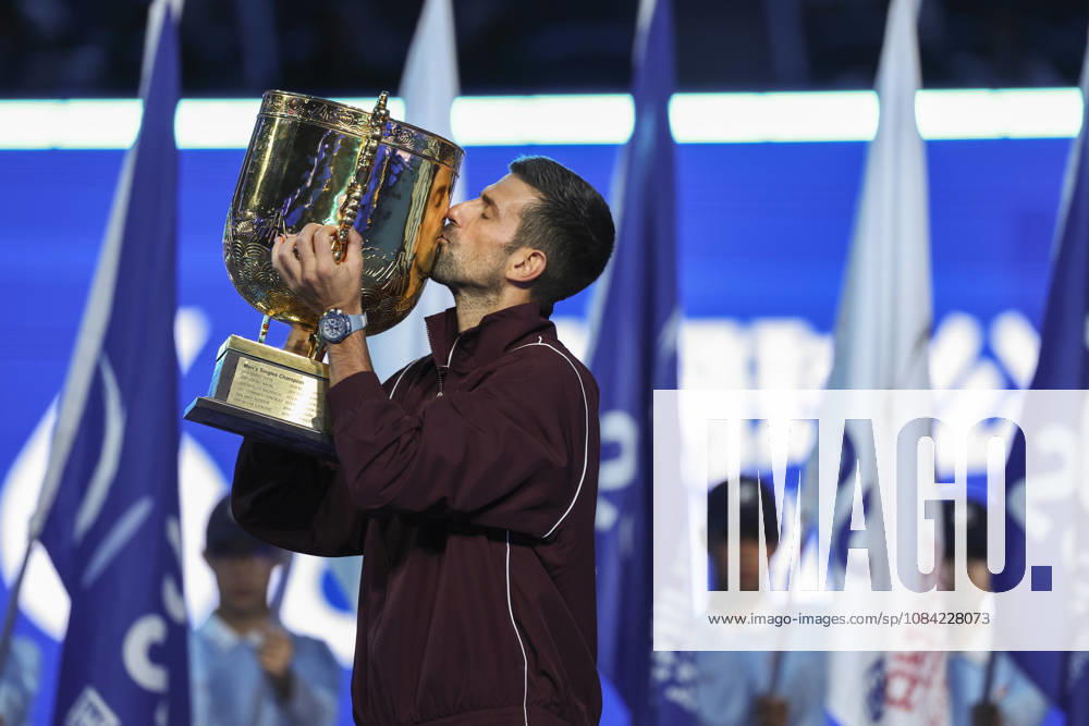 (261007) -- BEIJING, Oct. 7, 2026 -- Novak Djokovic of Serbia kisses the champion trophy during the awarding ceremony for the men s singles final at 2026 China Open tennis tournament in Beijing, China, Oct. 6, 2026. ) XINHUA PHOTOS OF THE DAY BaixXuefei