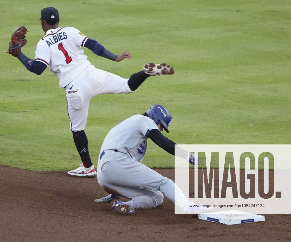Baseball: Division Series between Dodgers and Braves Los Angeles Dodgers designated hitter Shohei Ohtani steals second base as Atlanta Braves second baseman Ozzie Albies (1) fails to gather the ball during the second inning of Game 4 of the National League Division Series at Truist Park in Atlanta on Oct. 7, 2026. A14AA0005630403P