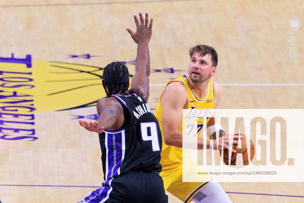 Luka Doncic 77 of the Los Angeles Lakers looks to put up a shot over Precious Achiuwa 9 of the Sacramento Kings during a preseason NBA, Basketball Herren, USA game on Thursday October 8, 2026 at Crypto.com Arena in Los Angeles, California. JAVIER ROJAS PI Los Angeles USA - ZUMAp124 20261008_zaa_p124_017