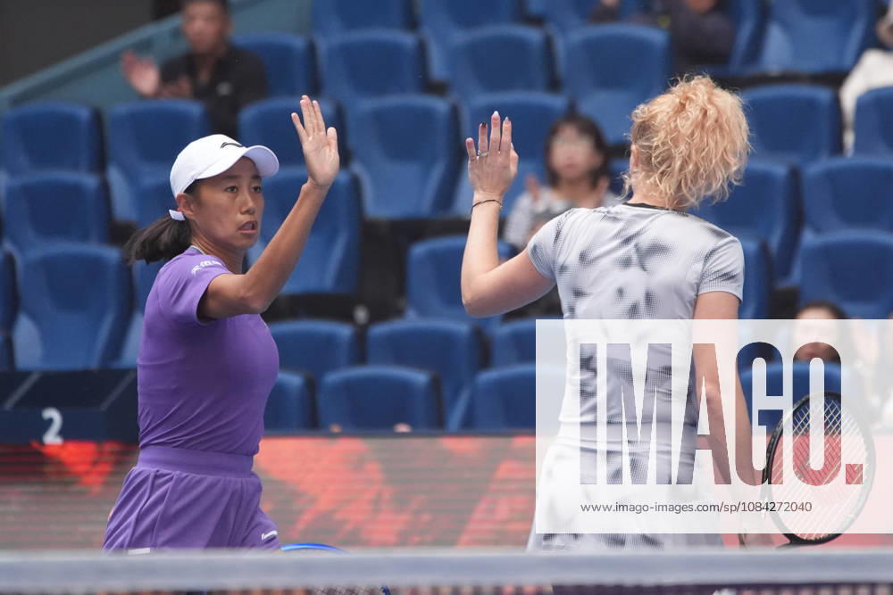 (261009) -- BEIJING, Oct. 9, 2026 -- Katerina Siniakova (R) Zhang Shuai celebrate scoring during the women s doubles quarterfinal match between Katerina Siniakova (the Cezch Republic) Zhang Shuai (China) and Storm Hunter (Australia) Kristina Mladenovic (France) at 2026 China Open tennis tournament in Beijing, China, Oct. 9, 2026. ) (SP)CHINA-BEIJING-TENNIS-CHINA OPEN-WOMEN S DOUBLES (CN) XiexHan