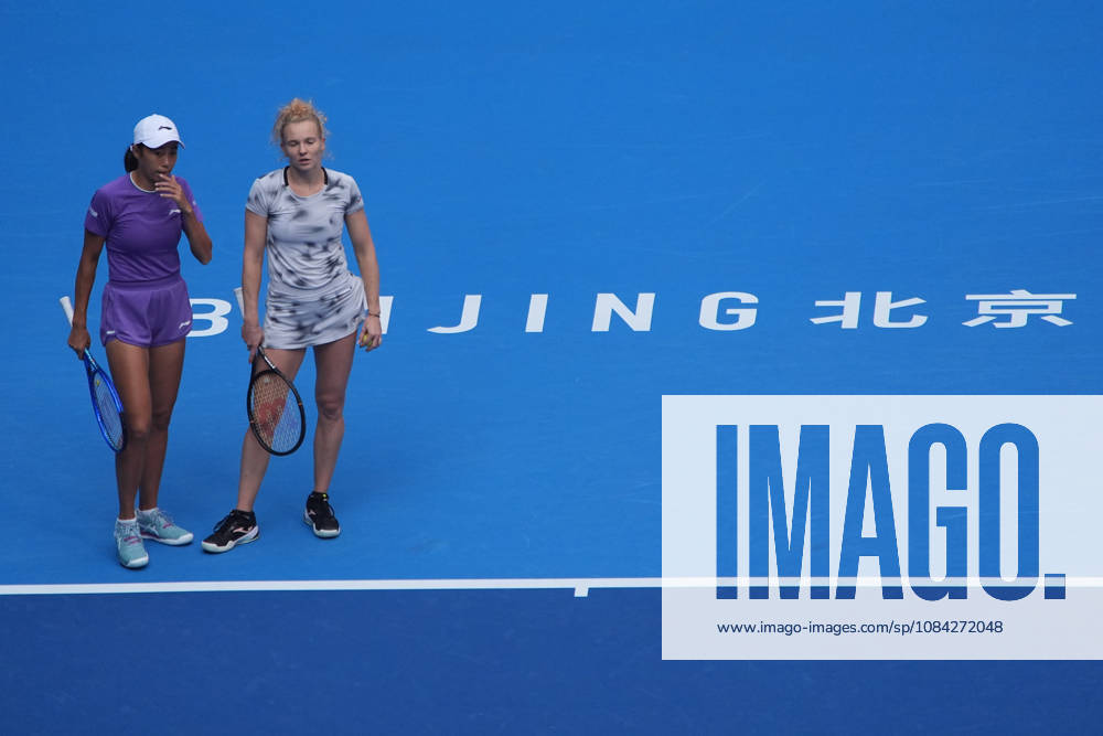 (261009) -- BEIJING, Oct. 9, 2026 -- Katerina Siniakova (R) Zhang Shuai react during the women s doubles quarterfinal match between Katerina Siniakova (the Cezch Republic) Zhang Shuai (China) and Storm Hunter (Australia) Kristina Mladenovic (France) at 2026 China Open tennis tournament in Beijing, China, Oct. 9, 2026. ) (SP)CHINA-BEIJING-TENNIS-CHINA OPEN-WOMEN S DOUBLES (CN) XiexHan