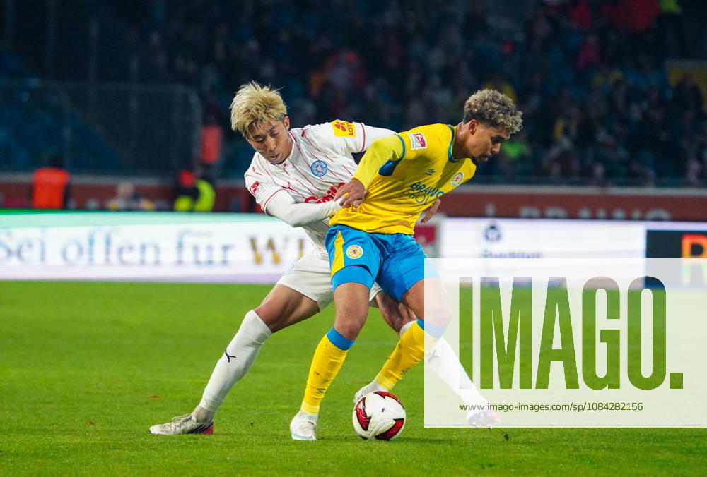 Deutschland: Fussball 2. Bundesliga 2026 2027, 7. Spieltag - Eintracht Braunschweig vs Holstein Kiel - Eintracht-Stadion (Braunschweig): im Zweikampf Yann Sturm (Eintracht Braunschweig, 7) Hiroki Sekine (Holstein Kiel, 32)