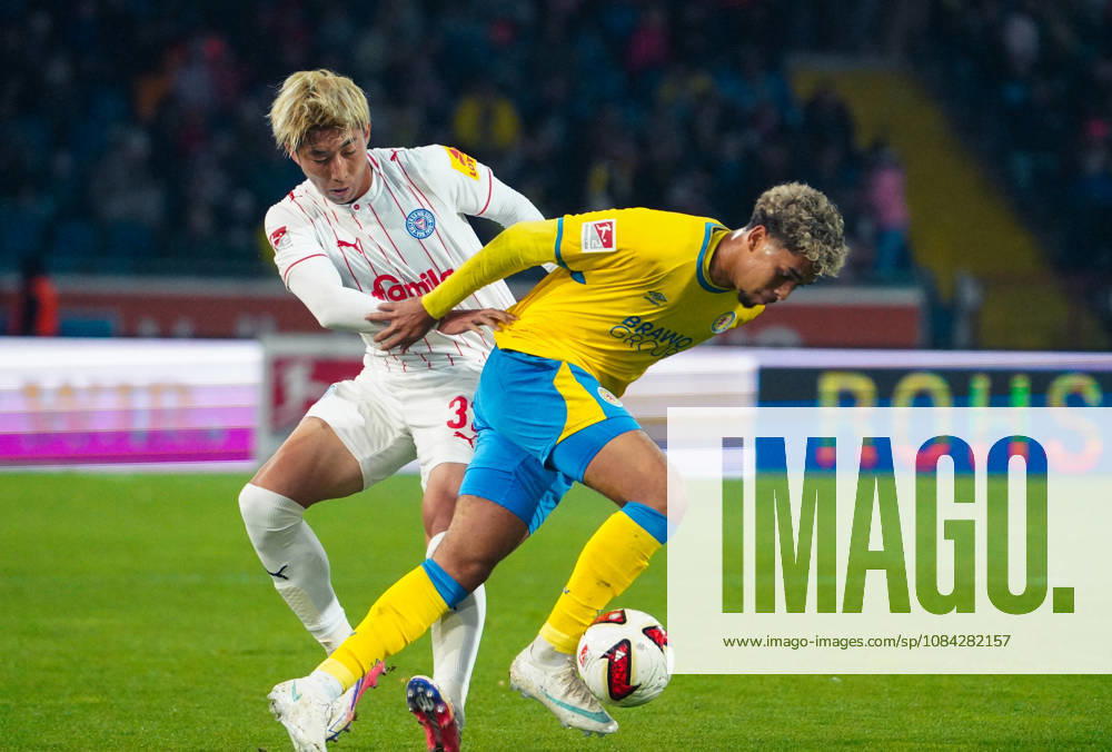 Deutschland: Fussball 2. Bundesliga 2026 2027, 7. Spieltag - Eintracht Braunschweig vs Holstein Kiel - Eintracht-Stadion (Braunschweig): im Zweikampf Yann Sturm (Eintracht Braunschweig, 7) Hiroki Sekine (Holstein Kiel, 32)