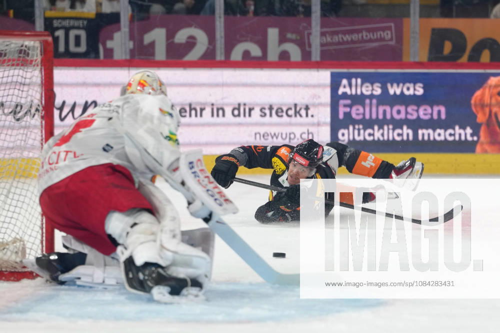 3014 Bern BE, Switzerland - October 09: Rodwin Dionicio (4 SCB) with a shoot while he falls on the ice during the National League match between SC Bern and EHC Biel-Bienne at PostFinance Arena on October 09, 2026 in 3014 Bern BE, Switzerland.