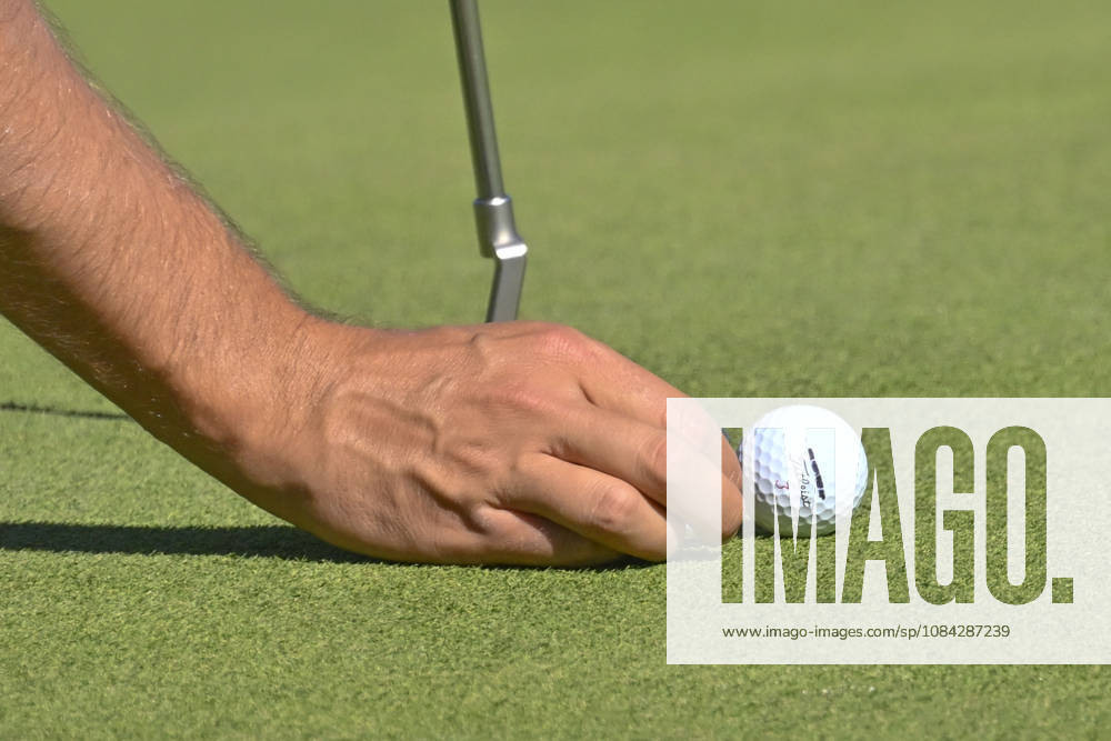 Close-up of a playerâ€⠢s hand placing the ball on the mark during the Open de Espao±a presented by Madrid at Club de Campo Villa de Madrid on October 09, 2026 in Madrid, Spain. Open GOLF De Spain Presented By Madrid - 10.09.26 (Second Day) - ZUMAc312 20261009_zsp_c312_428