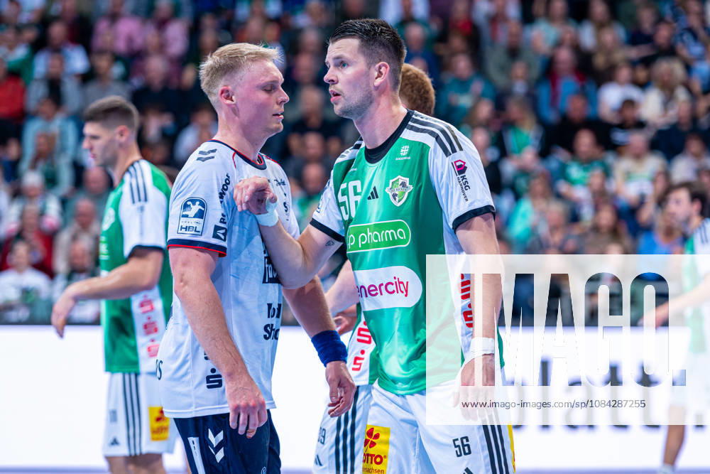 Hannes Feise (TSV Hannover-Burgdorf, Nr. 56) (v.l.), TSV Hannover-Burgdorf (grün) gegen SG Flensburg-Handewitt (blau) am 8. Spieltag der Saison 2026 2027 in der Opel Handball-Bundesliga (09.10.2026, ZAG Arena (Hannover, GER),