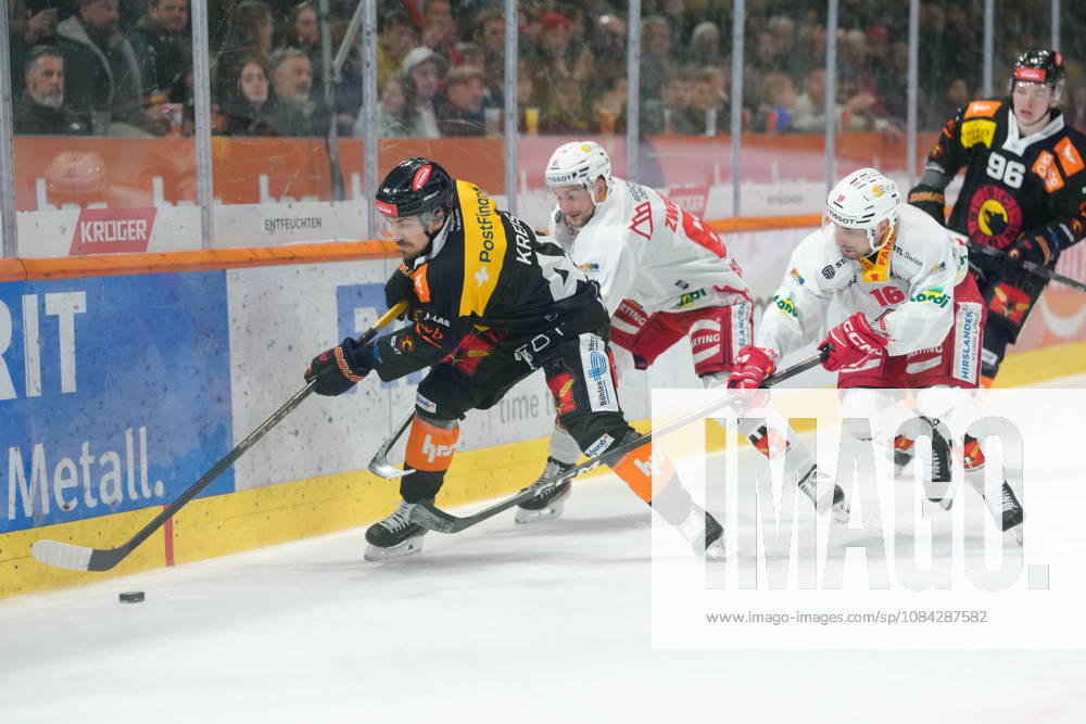 3014 Bern BE, Switzerland - October 09: Samuel Kreis (44 SCB) in duel for the puck against Dominic Zwerger (61 EHCB) and Fabio Hofer (16 EHCB) during the National League match between SC Bern and EHC Biel-Bienne at PostFinance Arena on October 09, 2026 in 3014 Bern BE, Switzerland.