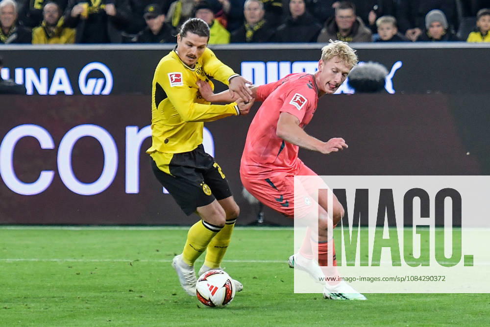 V. li. im Zweikampf Marcel Sabitzer (Dortmund 20) Justin Njinmah (Bremen 11) 09.10.2026 ¢ Fussball ¢ Borussia Dortmund vs SV Werder Bremen, Signal Iduna Park, Dortmund, DFB DFL REGULATIONS PROHIBIT ANY USE OF PHOTOGRAPHS AS IMAGE SEQUENCES AND OR QUASI-VIDEO NRW Germany