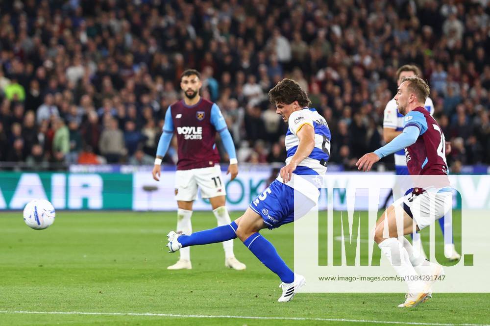 Ronnie Edwards of Queen Park Rangers with a shot on goal under pressure from Jarrod Bowen of West Ham United West Ham United v Queens Park Rangers, EFL Championship, Football, London Stadium, London, UK - 09 Oct 2026London London Stadium United Kingdom