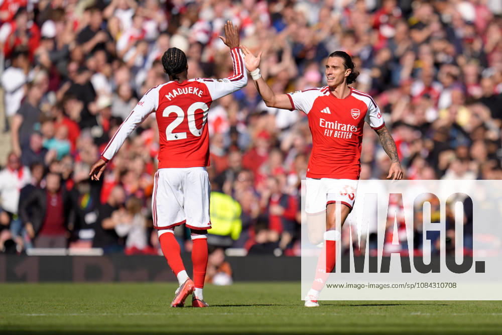 10th October 2026; Emirates Stadium, London, England; Premier League Football, Arsenal versus Leeds United; Riccardo Calafiori of Arsenal high fives Noni Madueke of Arsenal after scoring the equaliser to make it 1-1 in the 62nd minute TomxMajor
