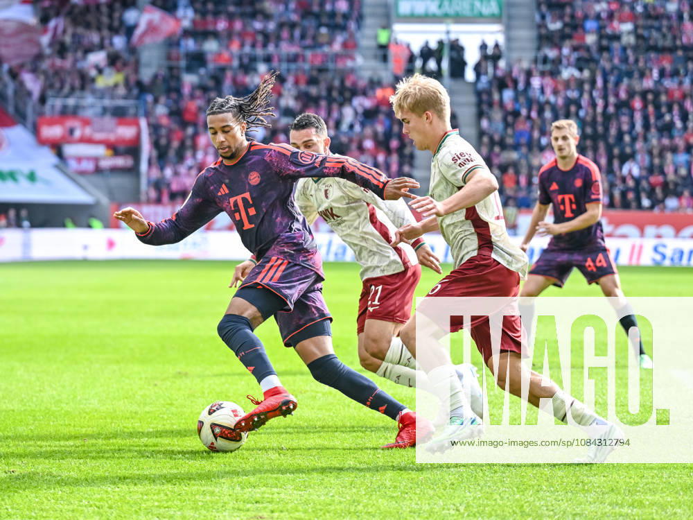 Michael Olise (FC Bayern Muenchen), Arijon Ibrahimovic (FC Augsburg) und Hennes Behrens (FC Augsburg) im Zweikampf waehrend des spiels der 1. Bundesliga zwischen FC Augsburg und FC Bayern Muenchen, WWK Arena am 10. October 2026 in Augsburg, Deutschland. (Foto von Harry Langer DeFodi Images) +++ Michael Olise (FC Bayern Muenchen), Arijon Ibrahimovic (FC Augsburg) und Hennes Behrens (FC Augsburg) battle for the ball during the Bundesliga match between FC Augsburg and FC Bayern Muenchen at WWK Arena on October 10, 2026 in Augsburg, Germany. (Photo by Harry Langer DeFodi Images) DFB DFL REGULATIONS PROHIBIT ANY USE OF PHOTOGRAPHS AS IMAGE SEQUENCES AND OR QUASI-VIDEO. (Photo by Harry Langer DeFodi Images) DFB DFL REGULATIONS PROHIBIT ANY USE OF PHOTOGRAPHS AS IMAGE SEQUENCES AND OR QUASI-VIDEO. -