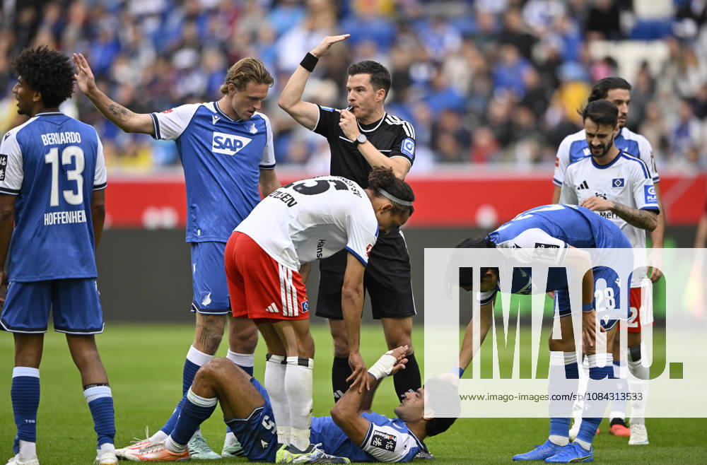 Verletzt Verletzung Ozan Kabak TSG 1899 Hoffenheim (05) Schiedsrichter Referee Harm Osmers ruft Betreuer TSG 1899 Hoffenheim vs Hamburger SV HSV 10.10.2026 DFL REGULATIONS PROHIBIT ANY USE OF PHOTOGRAPHS AS IMAGE SEQUENCES AND OR QUASI-VIDEO TSG 1899 Hoffenheim vs Hamburger SV HSV