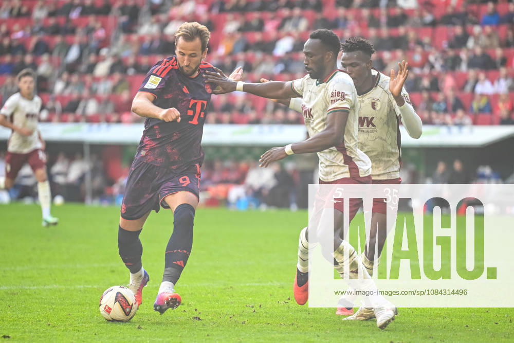Harry Kane (FC Bayern Muenchen), Chrislain Matsima (FC Augsburg) und Juma Bah (FC Augsburg) im Zweikampf waehrend des spiels der 1. Bundesliga zwischen FC Augsburg und FC Bayern Muenchen, WWK Arena am 10. October 2026 in Augsburg, Deutschland. (Foto von Harry Langer DeFodi Images) +++ Harry Kane (FC Bayern Muenchen), Chrislain Matsima (FC Augsburg) und Juma Bah (FC Augsburg) battle for the ball during the Bundesliga match between FC Augsburg and FC Bayern Muenchen at WWK Arena on October 10, 2026 in Augsburg, Germany. (Photo by Harry Langer DeFodi Images) DFB DFL REGULATIONS PROHIBIT ANY USE OF PHOTOGRAPHS AS IMAGE SEQUENCES AND OR QUASI-VIDEO. (Photo by Harry Langer DeFodi Images) DFB DFL REGULATIONS PROHIBIT ANY USE OF PHOTOGRAPHS AS IMAGE SEQUENCES AND OR QUASI-VIDEO. -