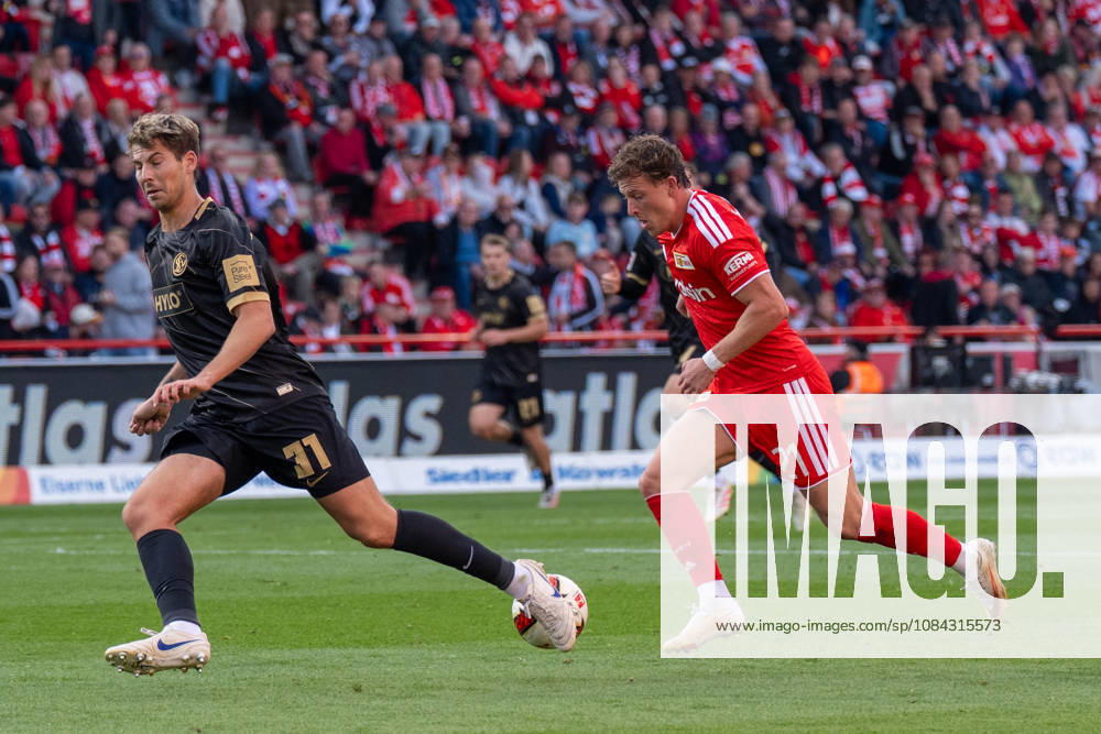 Deutschland: Fussball 1. Bundesliga, 5. Spieltag 2026 2027, 1.FC Union Berlin - SV Elversberg am 10.10.2026 in Berlin (Stadion An der Alten Försterei): Tim Skarke (1. FC Union Berlin, 21) am Ball Zweikampf mit Maximilian Rohr (SV Elversberg, 31)