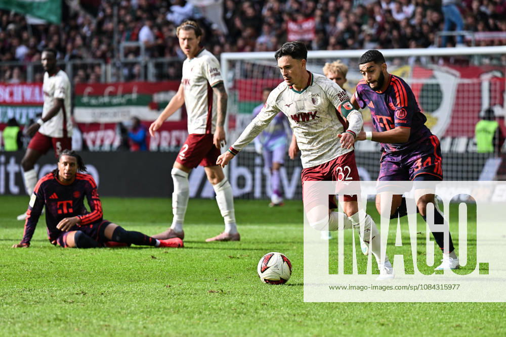 AUGSBURG, GERMANY; 10. OCTOBER: tackle between Fabian RIEDER (FC Augsburg 32) and Ismael SAIBARI (FC Bayern Munich 34) during the Bundesliga Match between FC Augsburg vs. FC Bayern Munich at Matchday 5 at WWK-Arena DFL REGULATIONS PROHIBIT ANY USE OF PHOTOGRAPHS AS IMAGE SEQUENCES AND OR QUASI-VIDEO