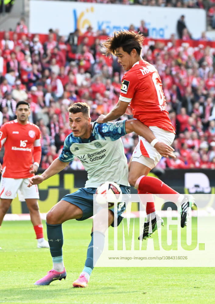 Fussball-Bundesliga - Saison 2026 2027 Mewa-Arena Mainz - 10.10.2026 1. FSV Mainz 05 (mz) - Bayer Leverkusen (lev) Patrik SCHICK (Bayer Leverkusen), li - Kaishu SANO (1. FSV Mainz 05) DFL REGULATIONS PROHIBIT ANY USE OF PHOTOGRAPHS AS IMAGE SEQUENCES AND OR QUASI VIDEO NATIONAL AND INTERNATIONAL NEWS AGENCIES OUT Fussball-Bundesliga - 1. FSV Mainz 05