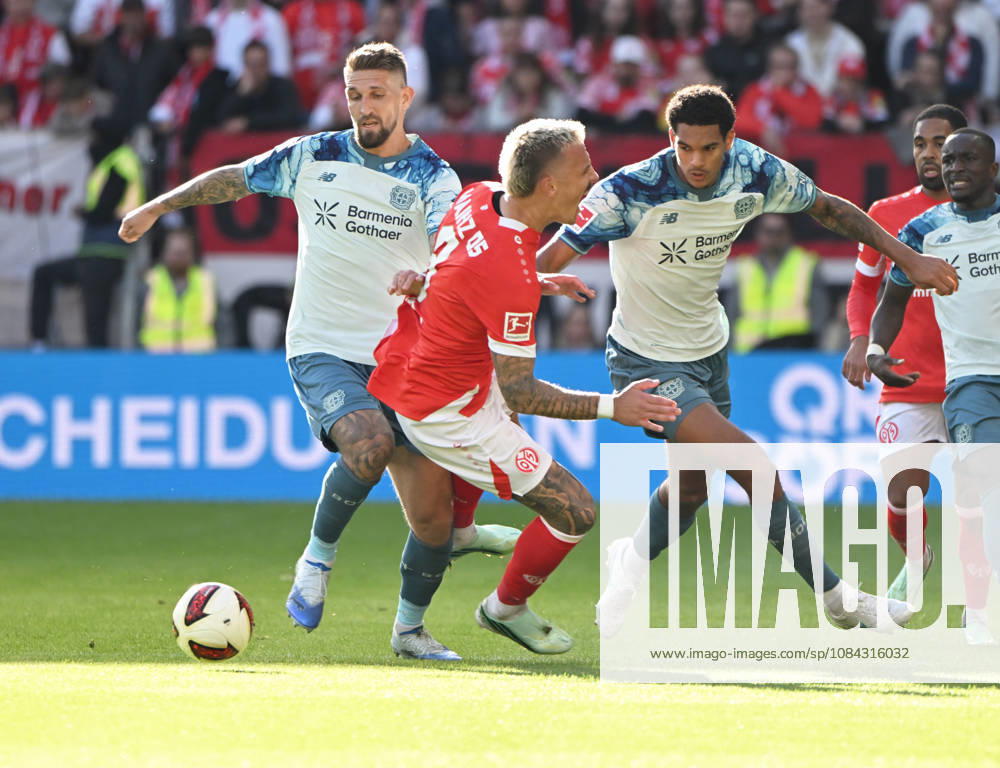Fussball-Bundesliga - Saison 2026 2027 Mewa-Arena Mainz - 10.10.2026 1. FSV Mainz 05 (mz) - Bayer Leverkusen (lev) V.li: Robert Andrich (Bayer Leverkusen), Phillip TIETZ (1. FSV Mainz 05), Jarell QUANSAH(Bayer Leverkusen) DFL REGULATIONS PROHIBIT ANY USE OF PHOTOGRAPHS AS IMAGE SEQUENCES AND OR QUASI VIDEO NATIONAL AND INTERNATIONAL NEWS AGENCIES OUT Fussball-Bundesliga - 1. FSV Mainz 05