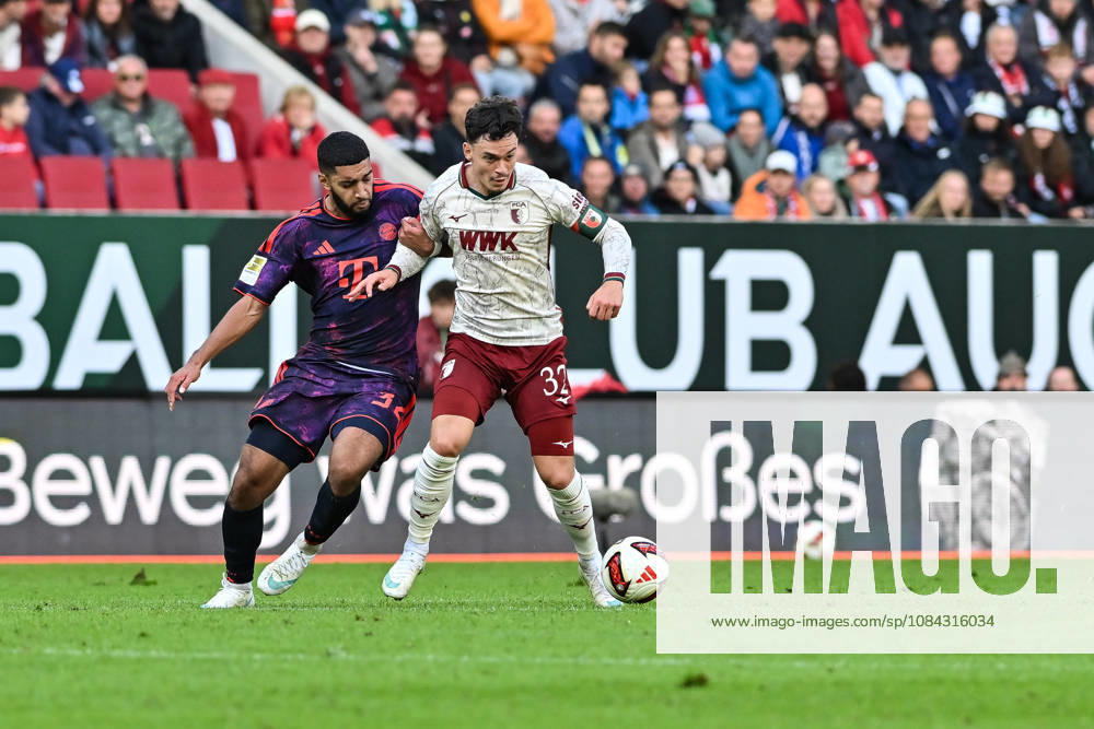 AUGSBURG, GERMANY; 10. OCTOBER: tackle between Ismael SAIBARI (FC Bayern Munich 34) and Fabian RIEDER (FC Augsburg 32) during the Bundesliga Match between FC Augsburg vs. FC Bayern Munich at Matchday 5 at WWK-Arena DFL REGULATIONS PROHIBIT ANY USE OF PHOTOGRAPHS AS IMAGE SEQUENCES AND OR QUASI-VIDEO
