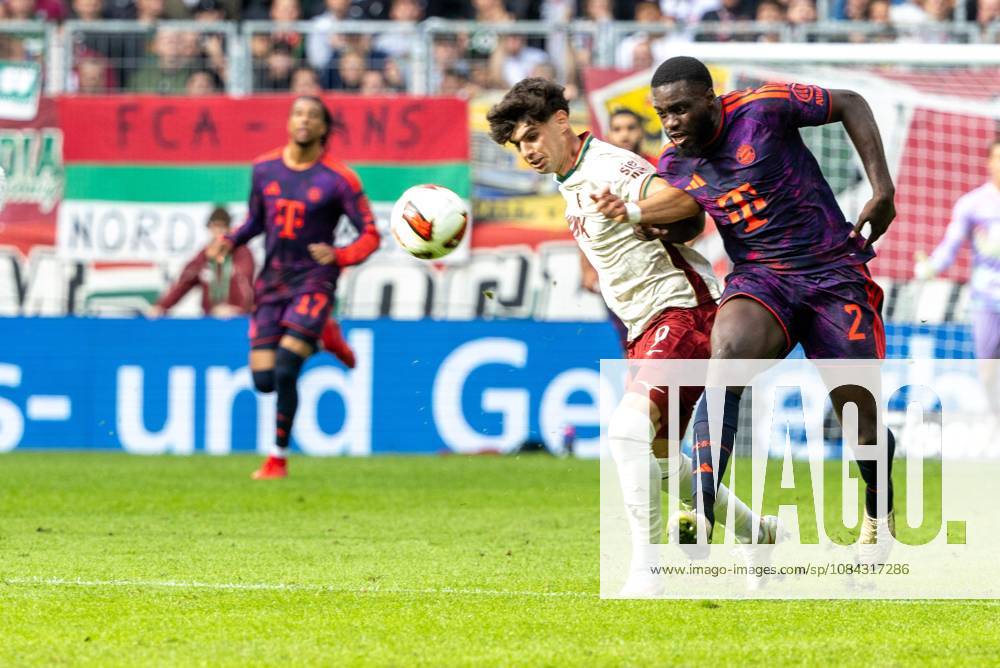 Rodrigo Ribeiro (FC Augsburg) und Dayot Upamecano (FC Bayern Muenchen) v-l im Zweikampf, FC Augsburg vs. FC Bayer Muenchen, Fussball-Bundesliga, Fussball, 1. Bundesliga, 5. Spieltag, 10.10..2026 DFL regulations prohibit any use of photographs as image sequences and or quasi-video