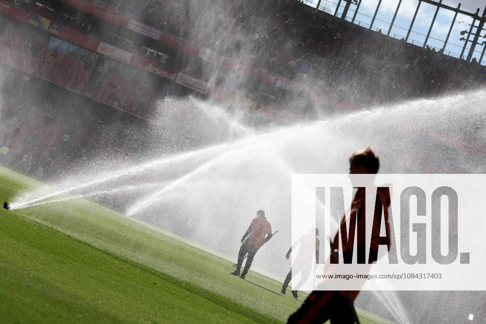 Arsenal v Leeds United 10 October 2026, London - Premier League Football - Arsenal v Leeds United - Groundskeepers stand amongst the pitch sprinklers - Photo: Charlotte Wilson Offside. London UK