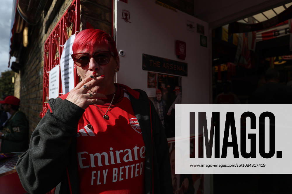 Arsenal v Leeds United 10 October 2026, London - Premier League Football - Arsenal v Leeds United - An Arsenal fan smokes a cigarette - Photo: Charlotte Wilson Offside. London UK