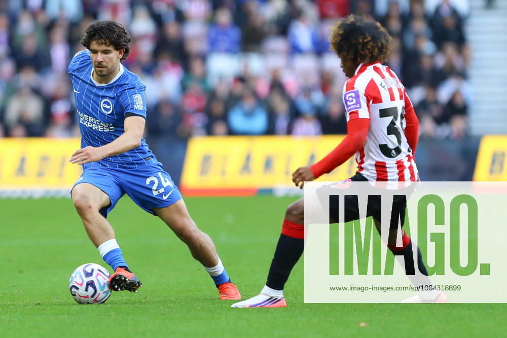 SUNDERLAND, ENGLAND, OCTOBER 10: Ferdi Kad?o?lu of Brighton & Hove Albion (L) dribbles the ball away from Malick Fofana of Sunderland AFC (R) during a Premier League 2026-27 match between Sunderland AFC and Brighton & Hove Albion at the Stadium of Light on October 10, 2026 in Sunderland, England. (Photo by Zach Forster Sports Press Photo)