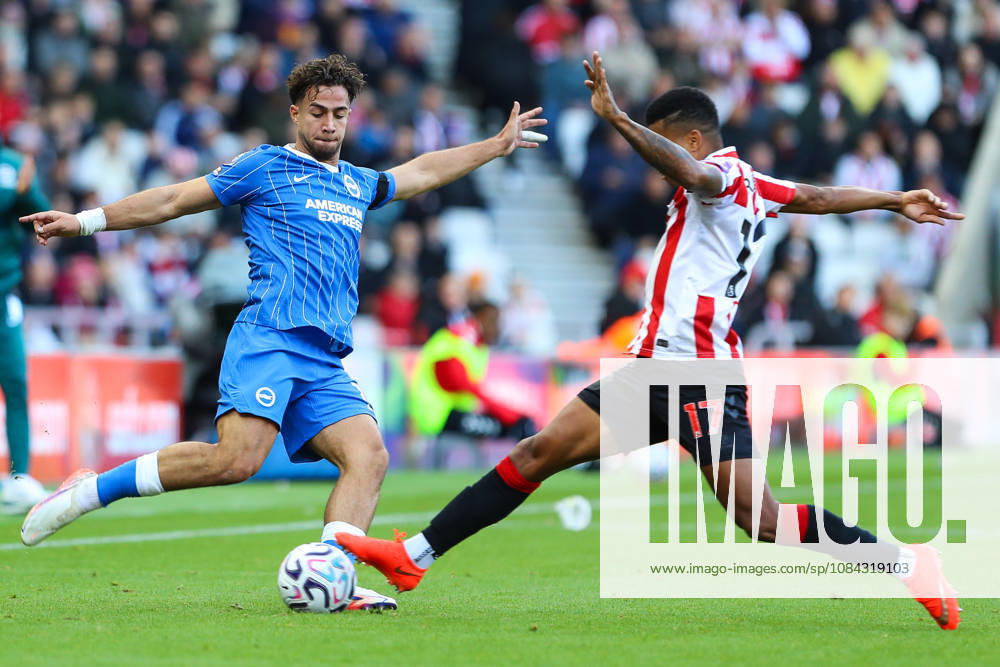 SUNDERLAND, ENGLAND, OCTOBER 10: Charalampos Kostoulas of Brighton & Hove Albion (L) is tackled by Reinildo Mandava of Sunderland AFC (R) during a Premier League 2026-27 match between Sunderland AFC and Brighton & Hove Albion at the Stadium of Light on October 10, 2026 in Sunderland, England. (Photo by Zach Forster Sports Press Photo)