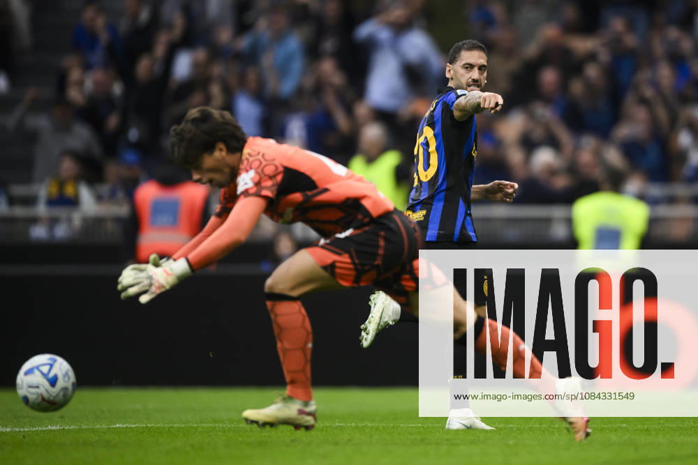 FC Internazionale v Parma Calcio - Serie A Hakan Calhanoglu of FC Internazionale celebrates after scoring a goa from a penalty kick as Edoardo Corvi of Parma Calcio looks dejectged during the Serie A football match between FC Internazionale and Parma Calcio. Milan Italy