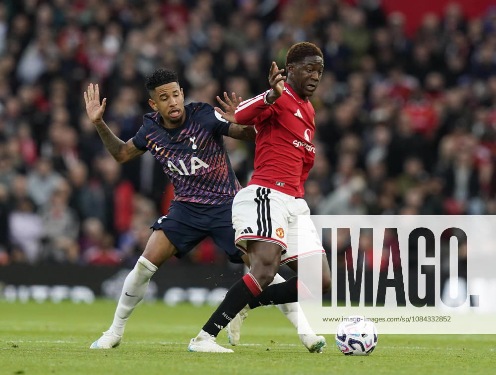 Manchester, England, 10th October 2026. Savio of Tottenham tackles Kobbie Mainoo of Manchester United, ManU during the Manchester United vs Tottenham Hotspur Premier League match at Old Trafford, Manchester. Picture credit should read: Andrew Yates Sportimage . SPI_037_AY_MANUTD_SPURS SPI-5058-0037