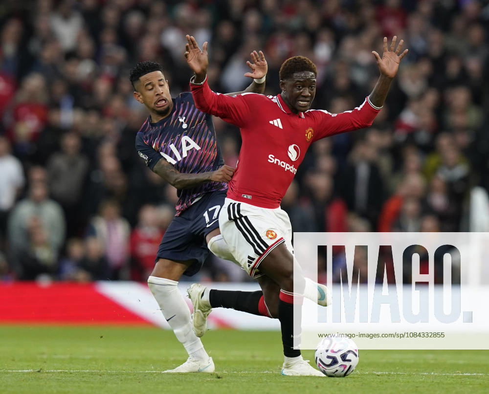 Manchester, England, 10th October 2026. Savio of Tottenham tackles Kobbie Mainoo of Manchester United, ManU during the Manchester United vs Tottenham Hotspur Premier League match at Old Trafford, Manchester. Picture credit should read: Andrew Yates Sportimage . SPI_038_AY_MANUTD_SPURS SPI-5058-0038