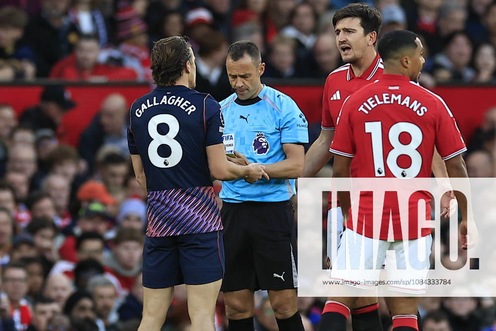 Manchester United, ManU v Tottenham Hotspur, Premier League Conor Gallagher (8) of Tottenham Hotspur gets booked for fouling Harry Maguire (5) of Manchester United during the Premier League match between Manchester United and Tottenham Hotspur at Old Trafford, Manchester, UK on 10 October 2026. Manchester Old Trafford Greater Manchester UK Editorial use only DataCo restrictions apply See www.football-dataco.com ,